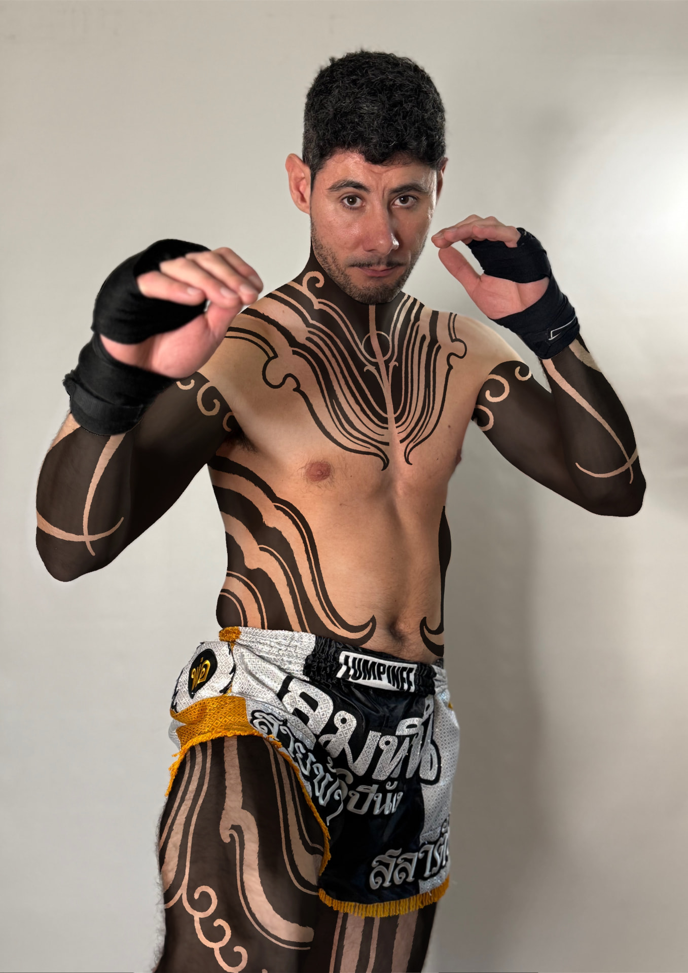 Full-body ornamental blackwork on a fighter in Muay Thai shorts and hand wraps
