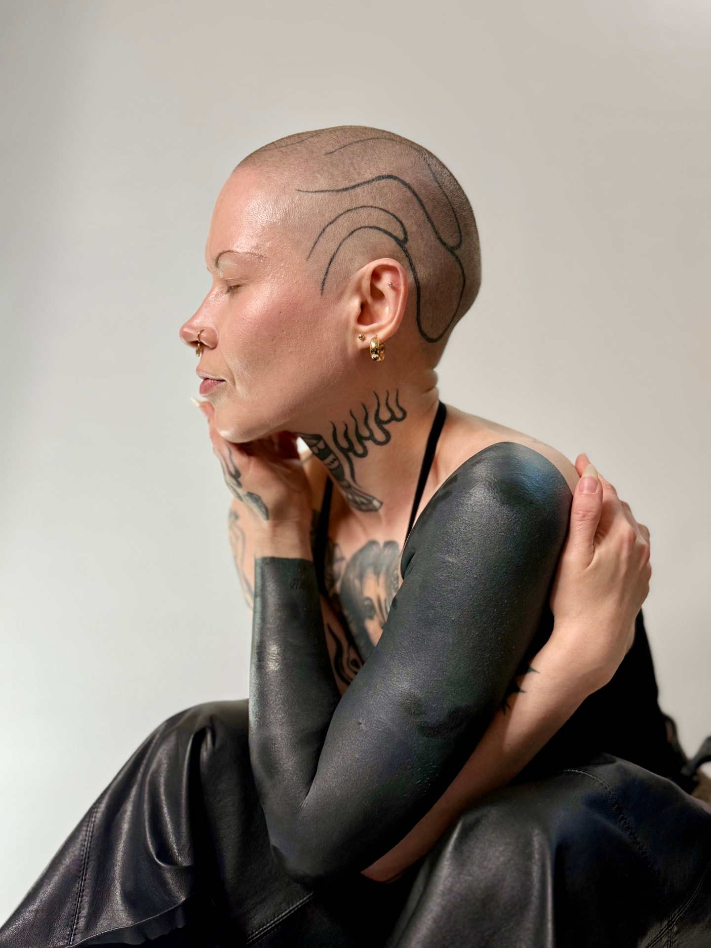 Blackout sleeves and head piece, portrait in profile